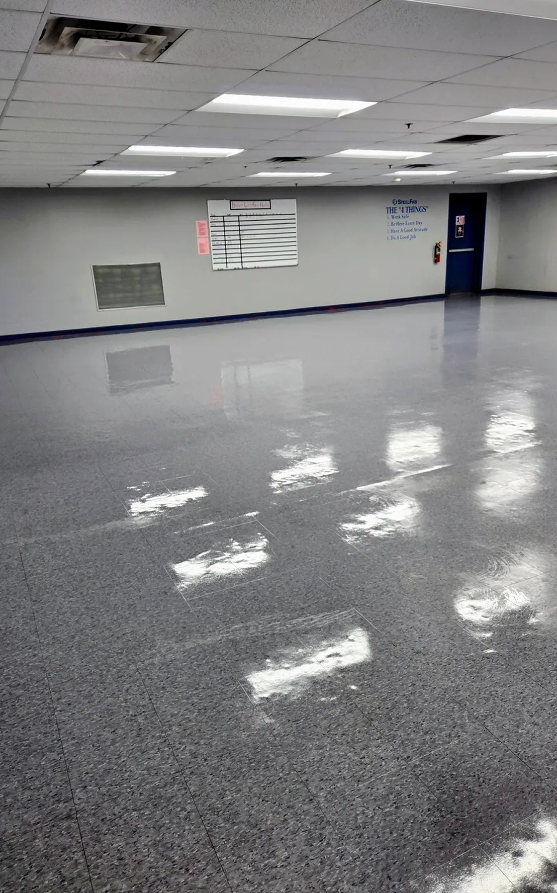 Spacious room with reflective flooring